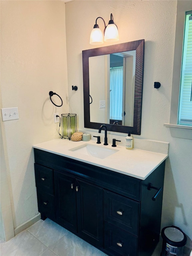 900 Boyd Ave, Lindale, TX 75701 - bathroom featuring vanity, tile patterned floors, and baseboards