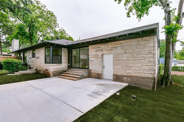 1447 Arizona Ave, Dallas, TX 75216 - view of front of house with stone siding, a chimney, a shingled roof, a patio, and entry steps