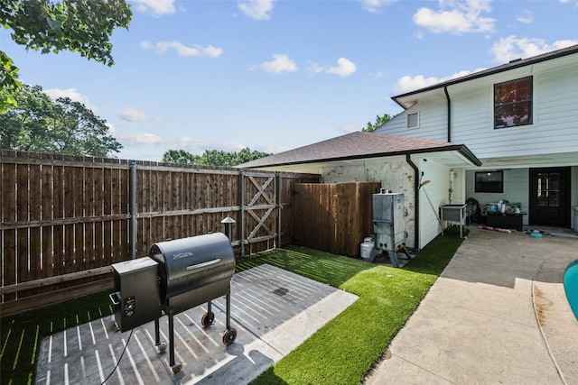 2902 Panhandle Dr, Grapevine, TX 76051 - fenced backyard with a patio and a gate
