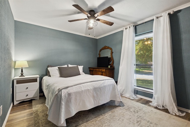 2902 Panhandle Dr, Grapevine, TX 76051 - bedroom with wood finished floors, ceiling fan, and ornamental molding