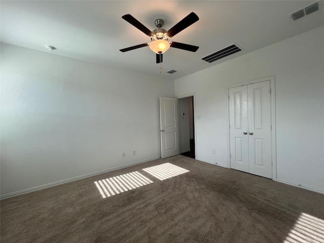 409 Petty Way, Fate, TX 75189 - unfurnished bedroom featuring carpet floors, a closet, baseboards, and a ceiling fan