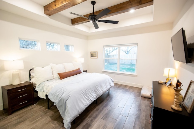 100 E 3rd St, Tolar, TX 76476 - bedroom with dark wood-type flooring, beamed ceiling, baseboards, a raised ceiling, and a ceiling fan