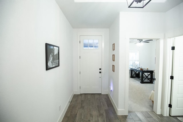 100 E 3rd St, Tolar, TX 76476 - entryway featuring wood finished floors, baseboards, and a ceiling fan