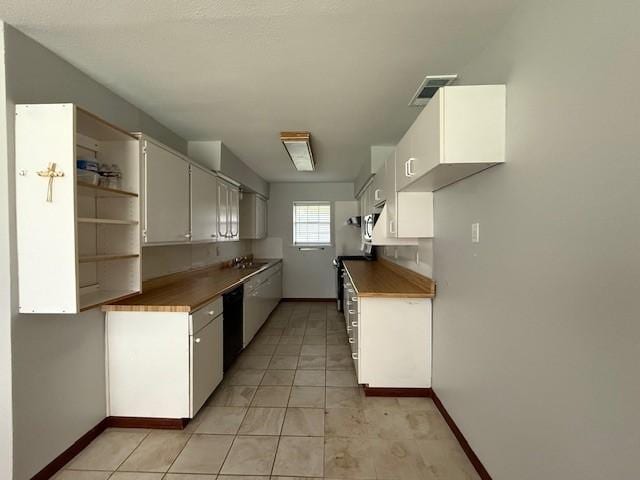 kitchen with baseboards, dishwasher, light tile patterned floors, and open shelves