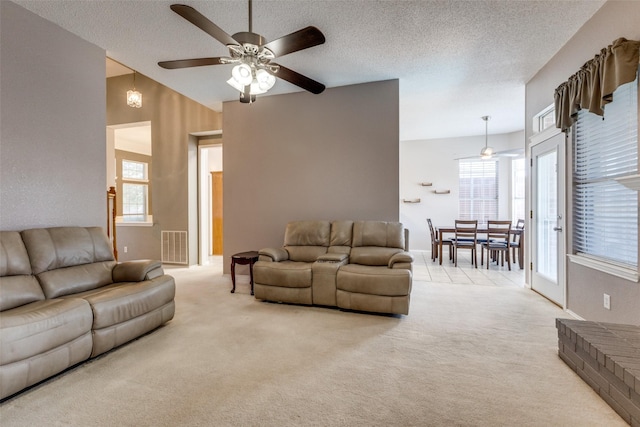 1729 Sheffield Dr, Garland, TX 75040 - living room featuring ceiling fan, light carpet, a textured ceiling, and baseboards