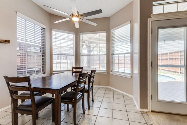 1729 Sheffield Dr, Garland, TX 75040 - dining area featuring ceiling fan, light tile patterned floors, and baseboards