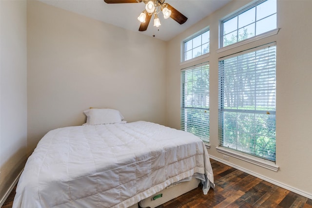 1729 Sheffield Dr, Garland, TX 75040 - bedroom featuring dark wood finished floors, baseboards, and a ceiling fan
