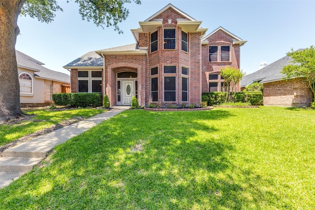1729 Sheffield Dr, Garland, TX 75040 - traditional-style home with brick siding and a front yard