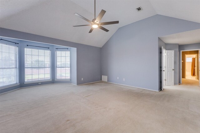 1729 Sheffield Dr, Garland, TX 75040 - unfurnished room featuring vaulted ceiling, light carpet, ceiling fan, and baseboards