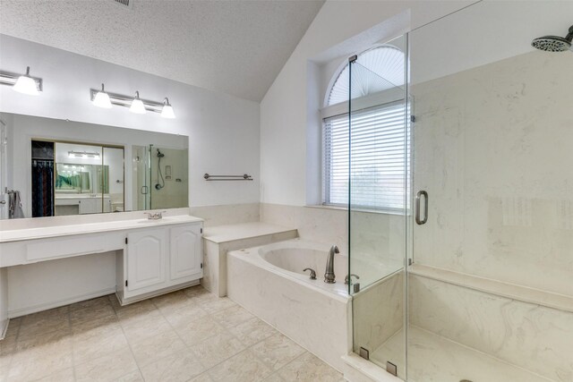 1729 Sheffield Dr, Garland, TX 75040 - full bath featuring a shower stall, vaulted ceiling, a garden tub, vanity, and a spacious closet