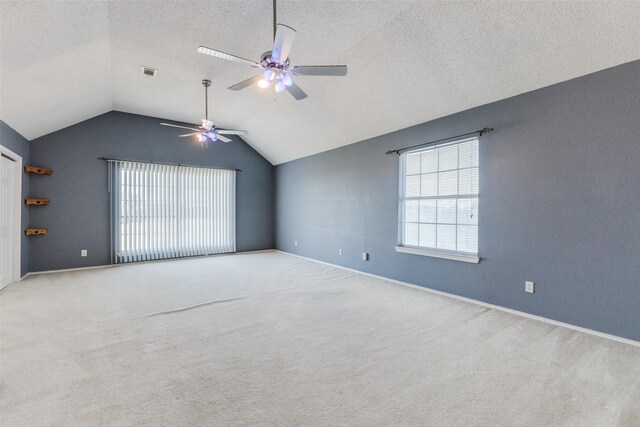 1729 Sheffield Dr, Garland, TX 75040 - empty room with lofted ceiling, a ceiling fan, carpet flooring, baseboards, and a textured ceiling