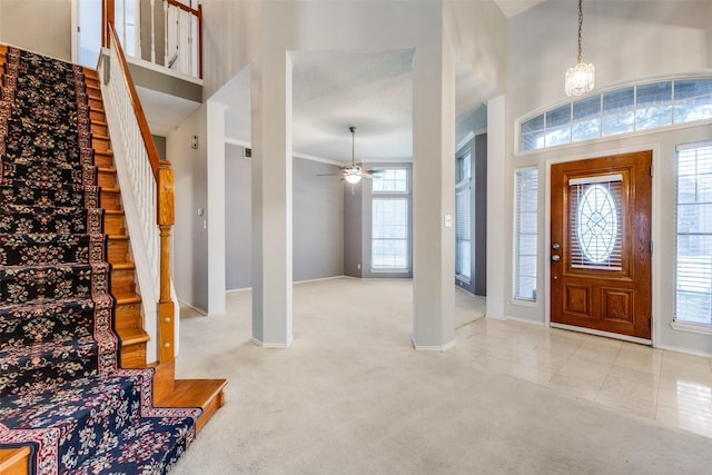 1729 Sheffield Dr, Garland, TX 75040 - carpeted foyer entrance with stairway, baseboards, a towering ceiling, and a ceiling fan