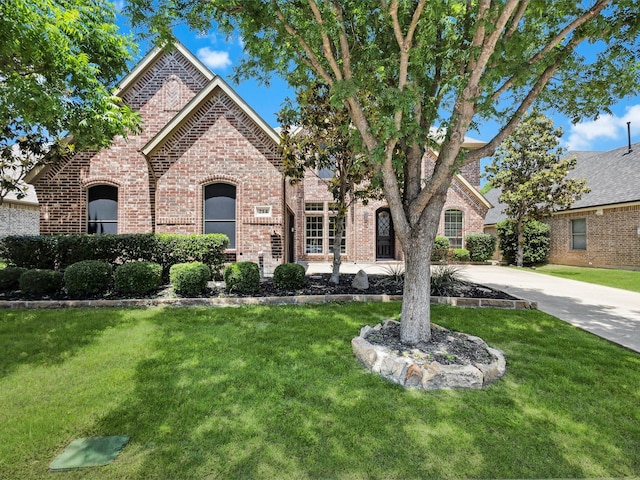 214 Crestbrook Dr, Rockwall, TX 75087 - view of front facade with brick siding and a front yard