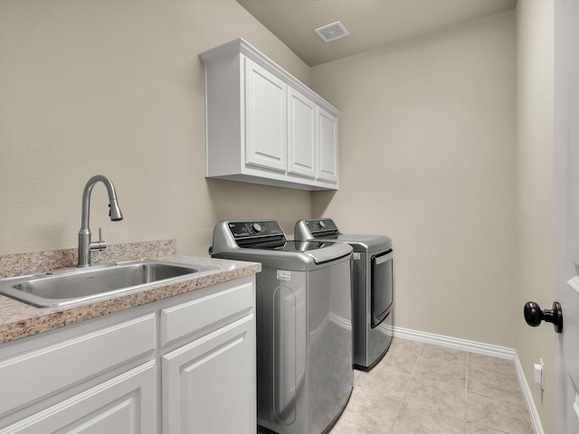 214 Crestbrook Dr, Rockwall, TX 75087 - clothes washing area featuring independent washer and dryer, cabinet space, baseboards, and light tile patterned floors