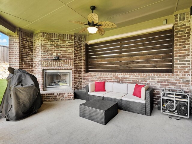 214 Crestbrook Dr, Rockwall, TX 75087 - carpeted living room with a ceiling fan, an outdoor brick fireplace, and brick wall