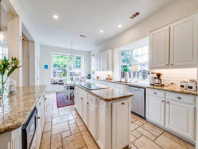 5040 Loma Alta Dr, Frisco, TX 75034 - kitchen featuring stainless steel dishwasher, stone tile floors, a sink, a kitchen island, and recessed lighting