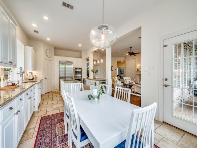 5040 Loma Alta Dr, Frisco, TX 75034 - dining space featuring stone tile floors, recessed lighting, and a ceiling fan