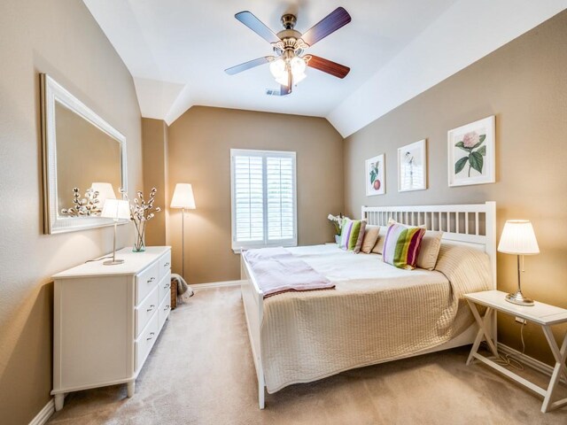 5040 Loma Alta Dr, Frisco, TX 75034 - bedroom with light carpet, baseboards, vaulted ceiling, and a ceiling fan