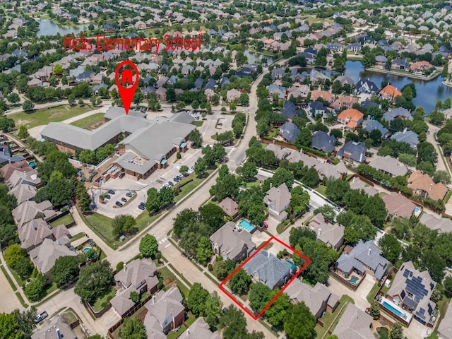 5040 Loma Alta Dr, Frisco, TX 75034 - aerial view of residential area featuring a large body of water and property boundaries highlighted