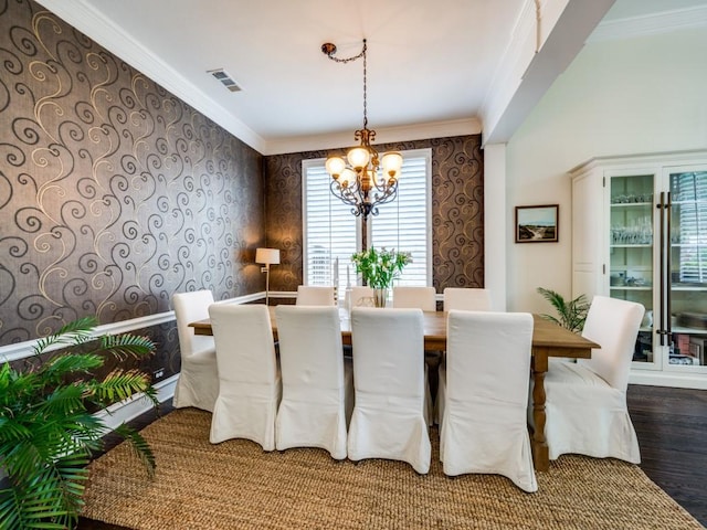 5040 Loma Alta Dr, Frisco, TX 75034 - dining area with a chandelier, ornamental molding, wood finished floors, and wallpapered walls