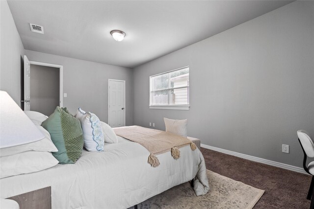 bedroom featuring carpet floors and baseboards
