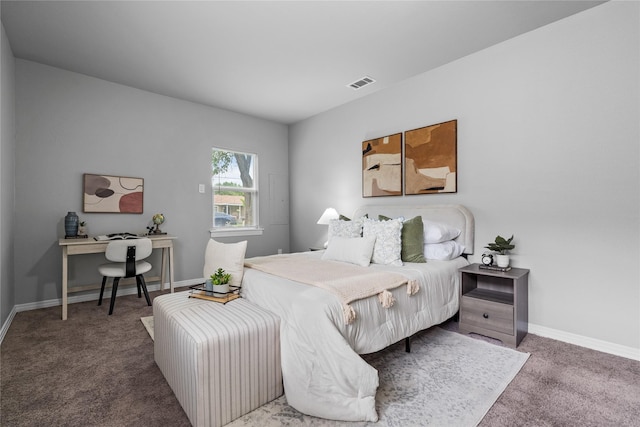 bedroom featuring carpet floors, baseboards, and an office area