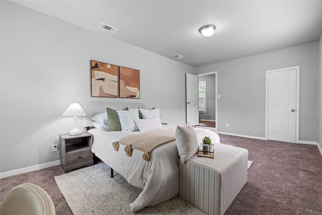 bedroom featuring carpet and baseboards
