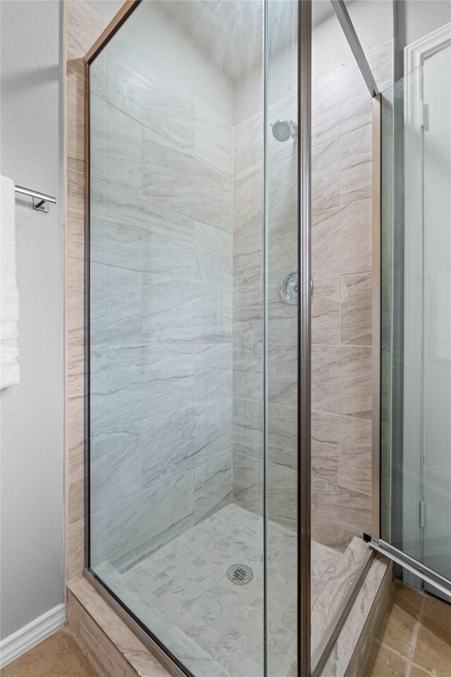 bathroom with a shower stall