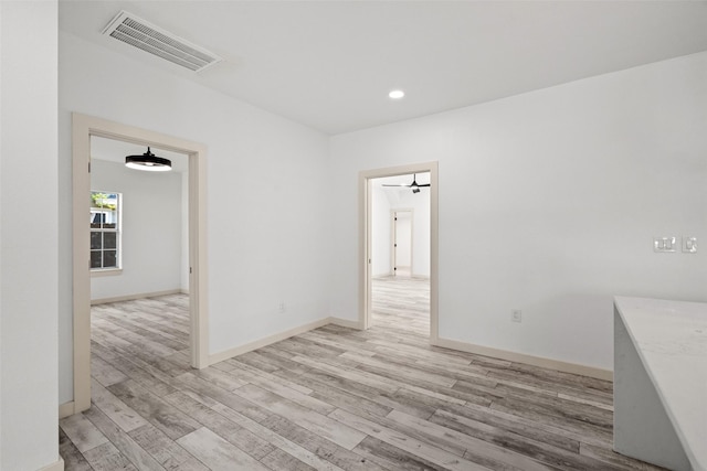 807 S Edgefield Ave, Dallas, TX 75208 - spare room with light wood-style floors, recessed lighting, and baseboards