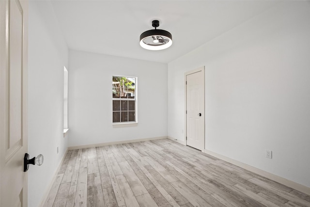 807 S Edgefield Ave, Dallas, TX 75208 - empty room with wood finished floors and baseboards
