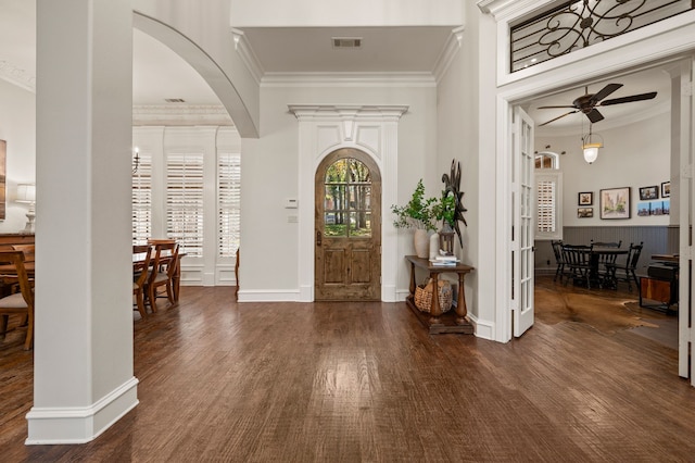 113 Welford Ln, Southlake, TX 76092 - entrance foyer with crown molding, ceiling fan, wood finished floors, arched walkways, and baseboards