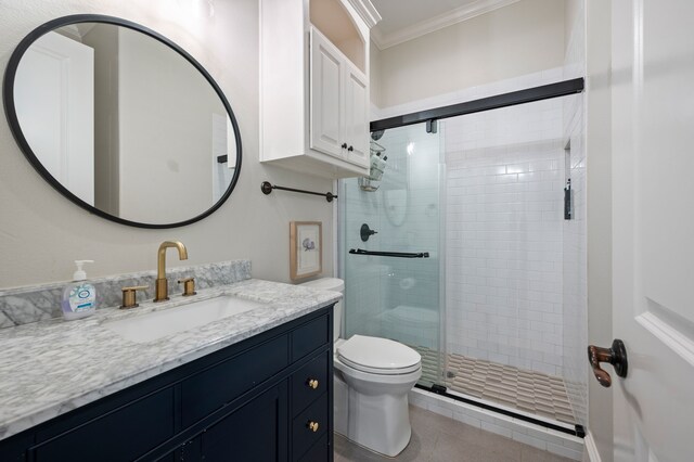 113 Welford Ln, Southlake, TX 76092 - full bathroom with ornamental molding, a stall shower, toilet, vanity, and tile patterned flooring