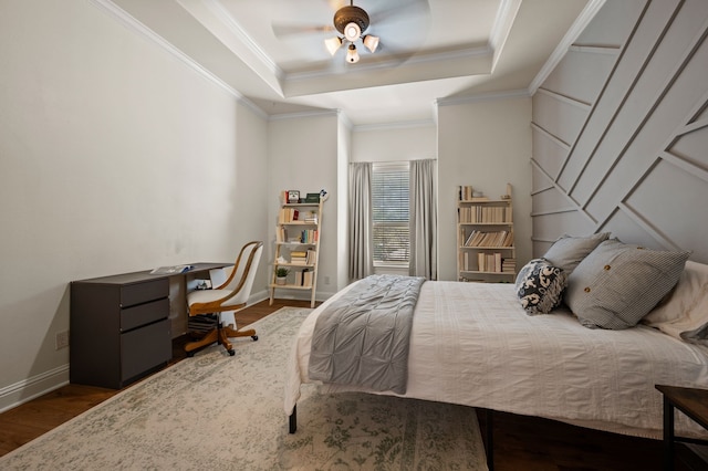 113 Welford Ln, Southlake, TX 76092 - bedroom featuring wood finished floors, a tray ceiling, baseboards, ornamental molding, and a ceiling fan