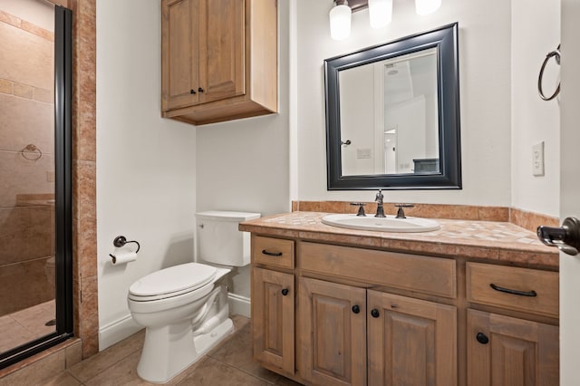 113 Welford Ln, Southlake, TX 76092 - bathroom featuring vanity, toilet, a shower stall, tile patterned floors, and baseboards