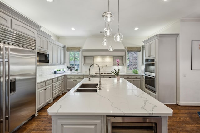 6005 Arboretum Dr, Frisco, TX 75034 - kitchen with appliances with stainless steel finishes, a sink, gray cabinetry, wine cooler, and decorative backsplash