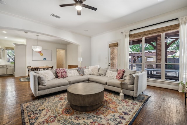 6005 Arboretum Dr, Frisco, TX 75034 - living room with ceiling fan, crown molding, arched walkways, wood finished floors, and recessed lighting