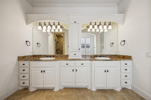 6005 Arboretum Dr, Frisco, TX 75034 - bathroom with baseboards, tiled shower, double vanity, ornamental molding, and tile patterned floors