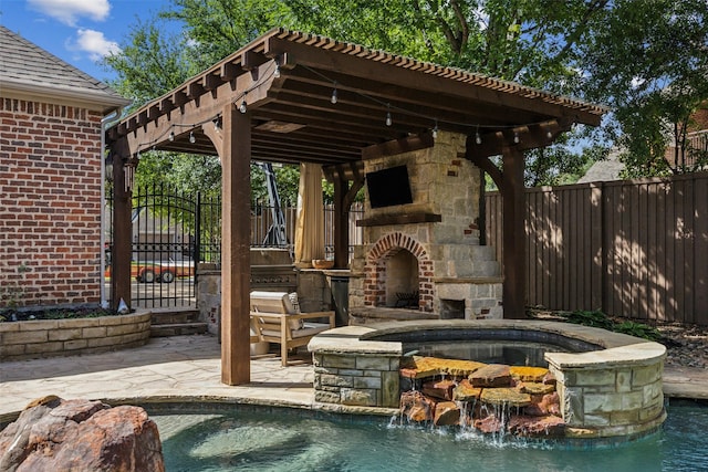 6005 Arboretum Dr, Frisco, TX 75034 - view of patio / terrace featuring an outdoor stone fireplace, a fenced backyard, and a pool with connected hot tub