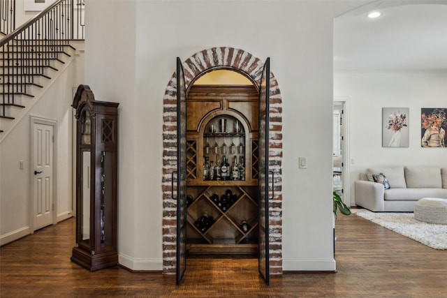 6005 Arboretum Dr, Frisco, TX 75034 - wine room featuring dark wood-style flooring, recessed lighting, and baseboards