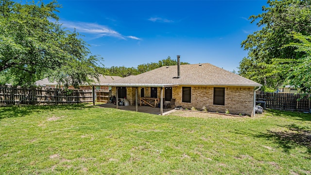 750 S First Ave, Stephenville, TX 76401 - back of house with a patio, brick siding, and roof with shingles