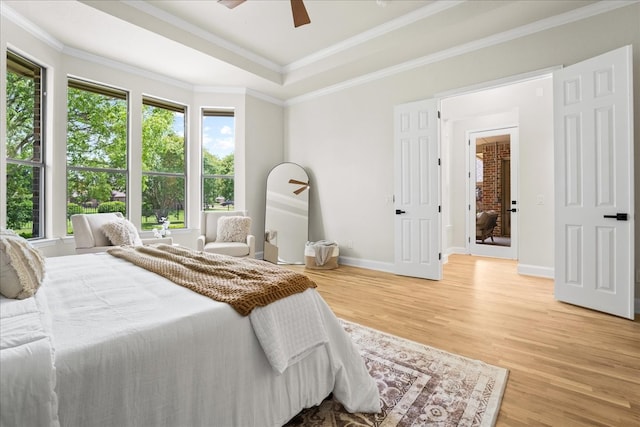 1740 Highland Meadows Dr, Prosper, TX 75078 - bedroom featuring light wood-style floors, a raised ceiling, ornamental molding, and a ceiling fan