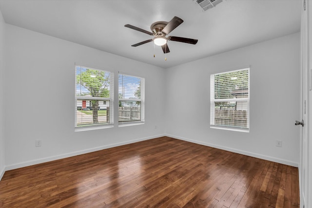 2305 Joey Dr, Waco, TX 76711 - unfurnished room with plenty of natural light, dark wood-style floors, and baseboards