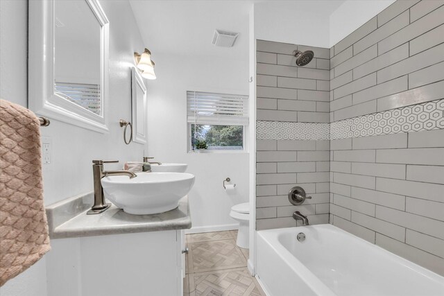 2305 Joey Dr, Waco, TX 76711 - bathroom with toilet, vanity, and tub / shower combination