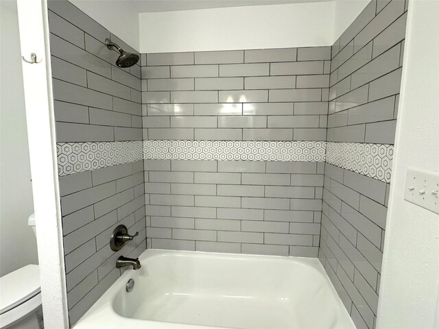 2305 Joey Dr, Waco, TX 76711 - bathroom featuring toilet and shower / bathtub combination