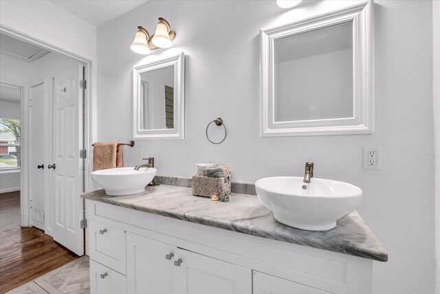2305 Joey Dr, Waco, TX 76711 - bathroom with double vanity and wood finished floors