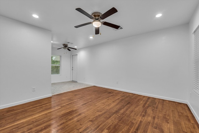 2305 Joey Dr, Waco, TX 76711 - empty room featuring wood finished floors, ceiling fan, baseboards, and recessed lighting