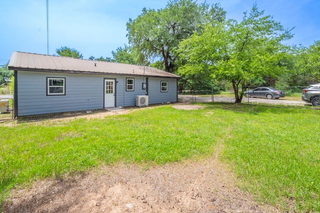 2612 S Oak Trl, Granbury, TX 76048 - back of house featuring ac unit and metal roof