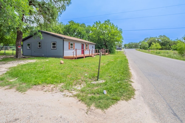 2612 S Oak Trl, Granbury, TX 76048 - ranch-style home with a wooden deck and a front yard