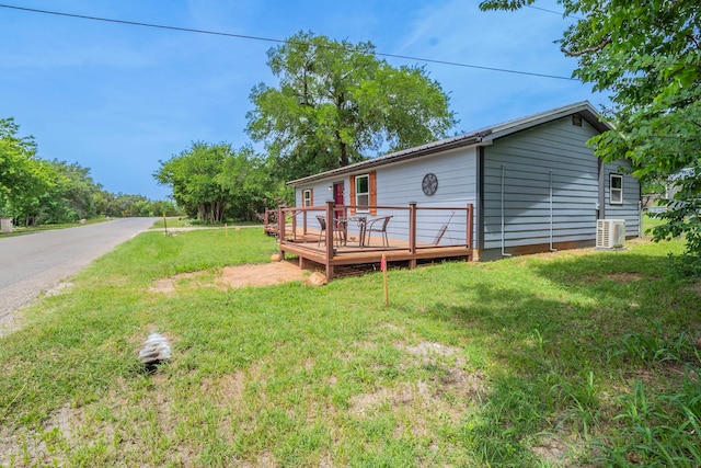 2612 S Oak Trl, Granbury, TX 76048 - view of front of home with a deck, a front lawn, and central air condition unit
