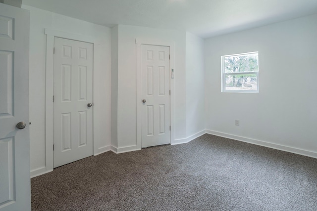 2612 S Oak Trl, Granbury, TX 76048 - unfurnished bedroom with dark carpet and baseboards